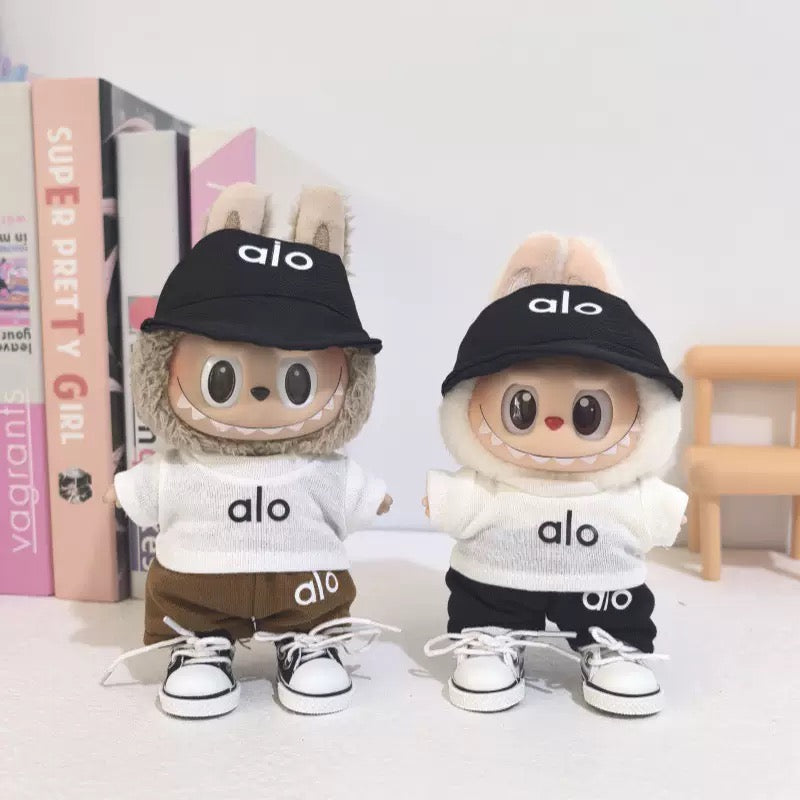 Monster Closet Labubu outfit wearing a black cap and outfit with 'alo' branding on a checkered background. a37-2