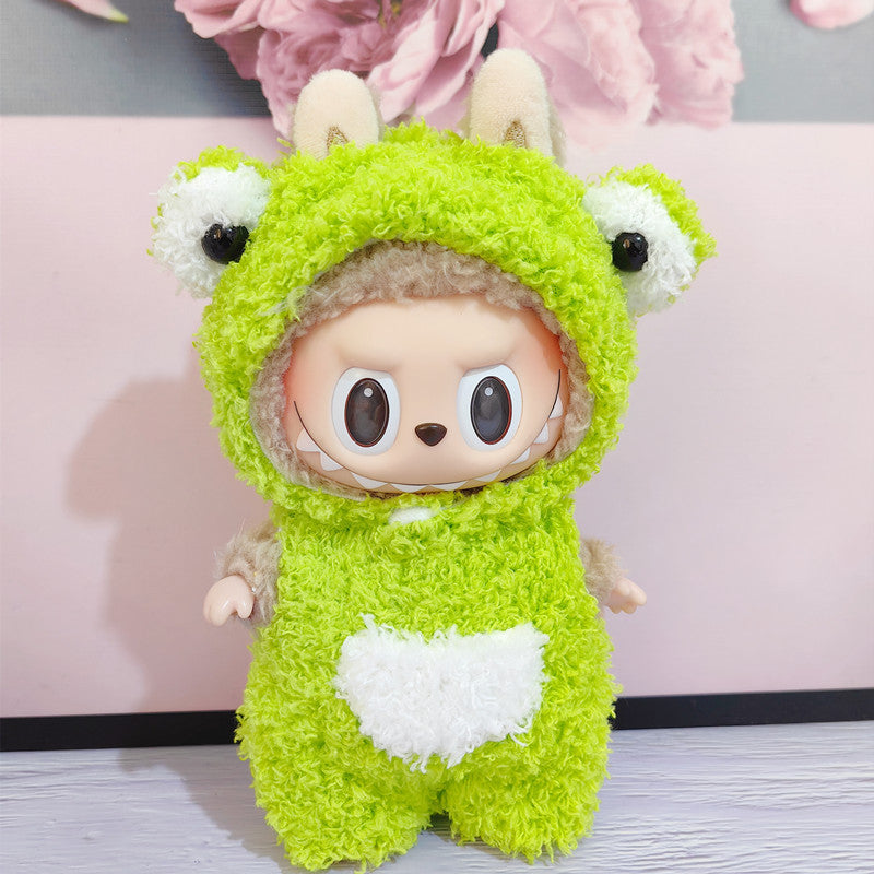 Monster Closet Labubu Outfit Stuffed toy in a green animal costume with a pink floral background