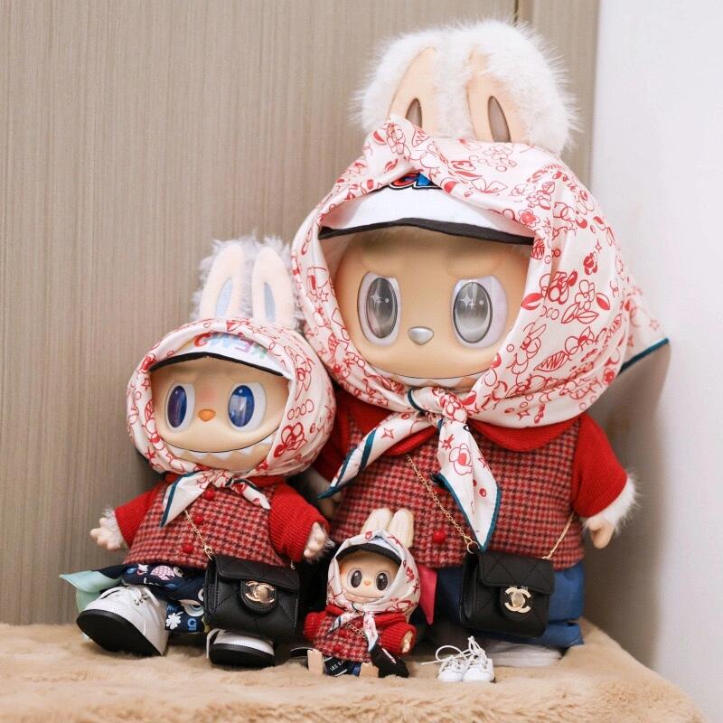 Monster Closet Labubu cloth inspired by G-Dragon, consist with a red checkered shirt, blue pants, and a white hood with red patterns